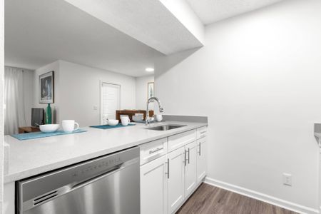 Kitchen with white cabinetry in an apartment complex in Clearwater, FL.