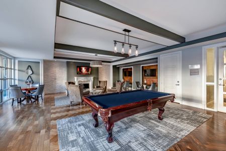 Resident Clubroom with Billiards, Lounge Area, Fireplace, and Flat Screen TVs