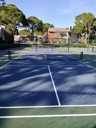Full size tennis court and two pickle ball courts