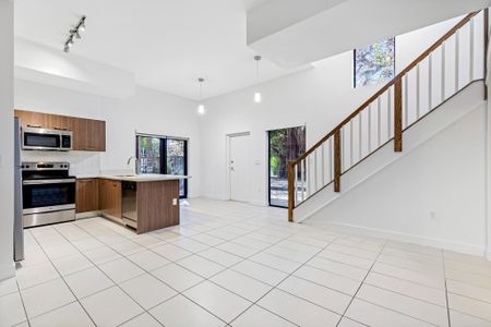 Interior photograph of living and lining area at townhome unit in Miami, FL.