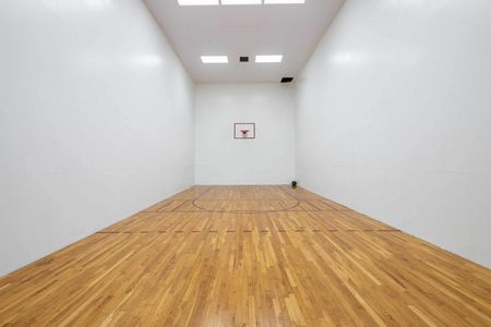 Indoor basketball court attached to gym.