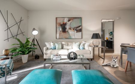 A white sofa and modern art inside a luxury apartment in Delray Beach.