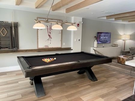 Community pool table at an East Pompano apartment.