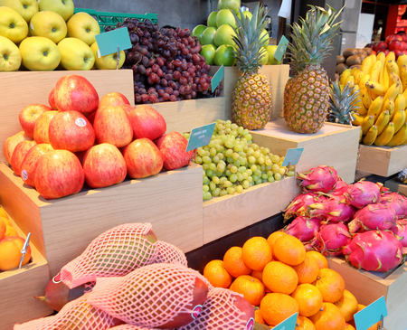 Fresh fruits and vegetables at a market near our apartments for rent in Coral Springs, featuring grapes, pineapples, and more.