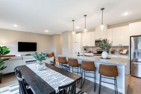 Kitchen island with black dining room table