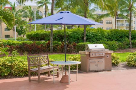 Country Club Towers, exterior, picnic tables with umbrellas, trees, landscaped, barbecue grill