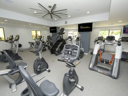 Fontainebleau Milton Apartments, interior, fitness center, stair climber, elliptical, bike machines