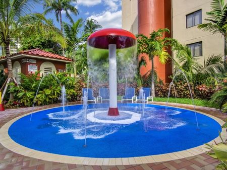 Fontainebleau Milton Apartments, exterior, children's splash pad and water fall, palm trees