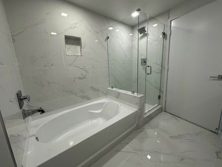 Bathroom with Tub and Glass Shower Enclosure