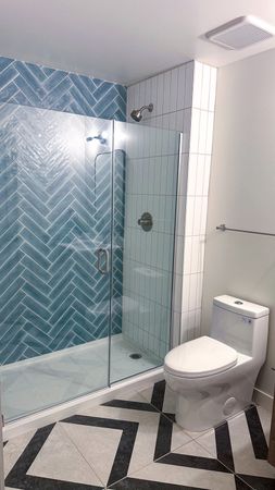 jefferson flats unit bathroom, blue tiled shower, tile floor