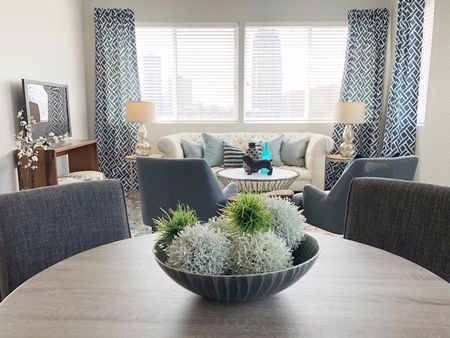 VUE | Living Room table & chairs, couch, TV, etc.  | Spacious Floor Plan at Vue apartments in Des Moines, IA