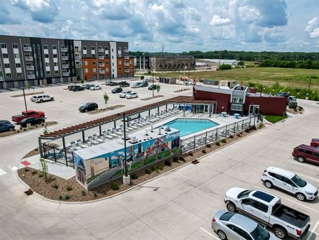 Pool area and parking at  LINC at Gray's Station apartments