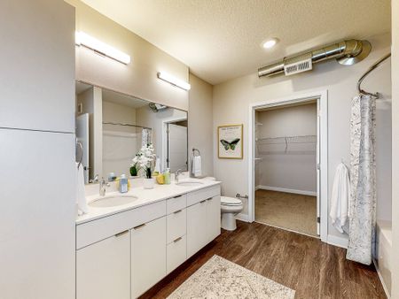 Bathroom with double vanity in apartment at  LINC at Gray's Station