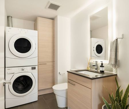 bathroom with washer and dryer