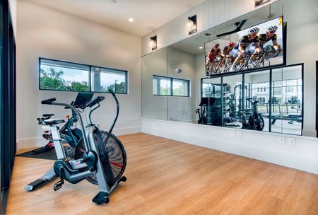 Fitness center with bike and mirrors