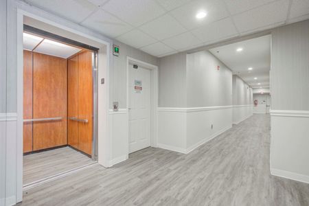 indoor hallway with elevator in apartment building