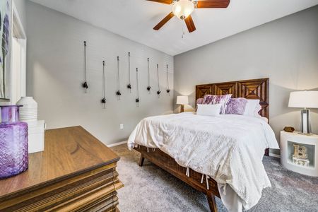 furnished bedroom with carpet