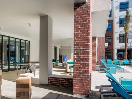 Outdoor Portico Games & Pool Seating | Tinsley on the Park | Apartments In Houston