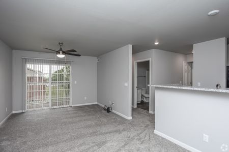 newly renovated open concept living space with sliding patio door