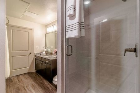 The Highbank | Houston, TX | Bathroom w/ Wood Flooring