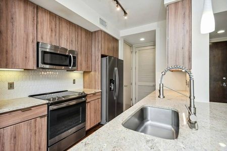 Venue Museum District | Houston, TX | Kitchen w/ Stainless Steel Appliances