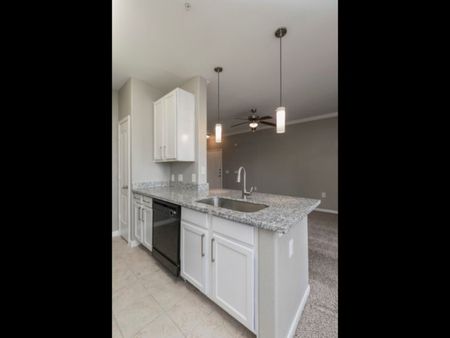 Sommerall Station | Cypress, TX | Pendant Lighting and White Cabinetry