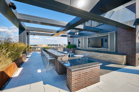 Outdoor Television and Dining- Meridian on First Rooftop | Luxury Navy Yard Apartments | Washington, DC Apartments