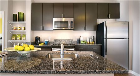 Kitchens with Granite Countertops, Islands, Stainless Steel Appliances and Wood-Style Flooring | 360 H Street | Washington DC Apartments | H Street Apartments