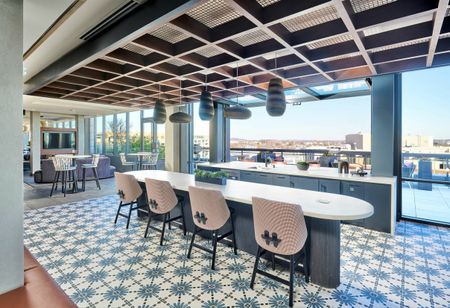 Expansive Rooftop Club Room With Indoor/Outdoor Area, Roof Deck Access, Fireplace & Numerous Seating Areas | Meridian on First | Navy Yard Apartments | Luxury Washington DC Apartments