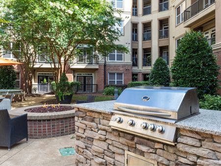 courtyard area with firepit and bbq stations