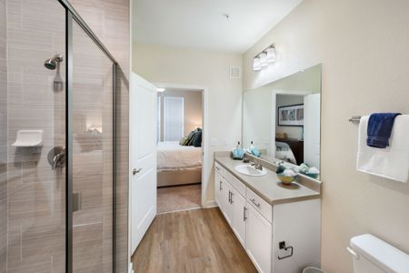 bathroom with glass doors and sink