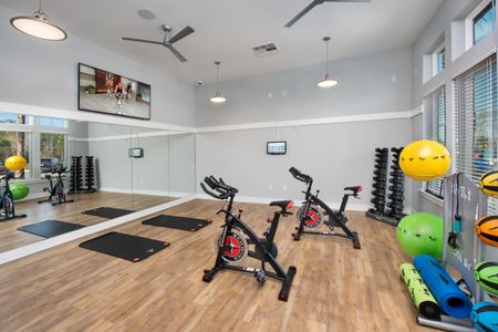 yoga and pilates fitness center gym with bicycles and exercise balls