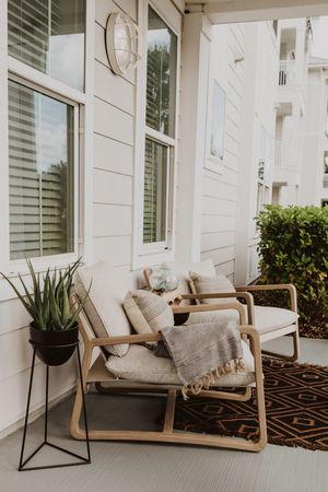 Put door patio with chairs and plants