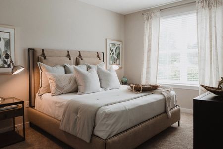 Furnished bedroom with bed and window
