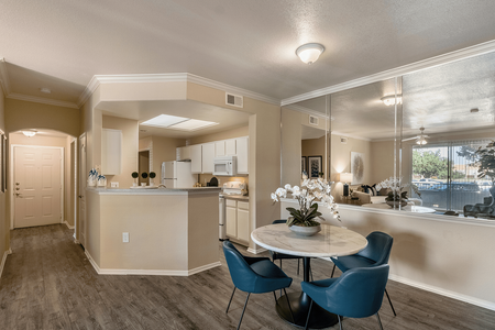 Model apartment dining area and kitchen