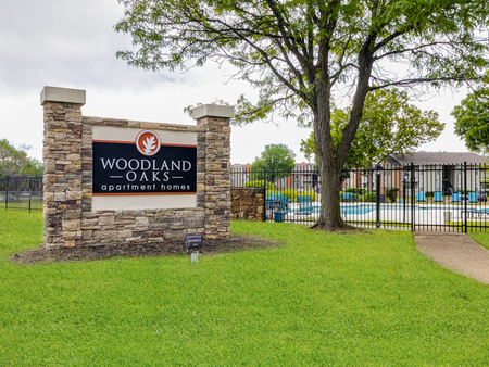 Woodland Oaks Sign by Pool