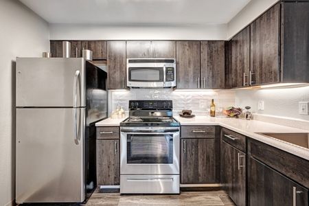 Open Kitchen with Stainless and Black Appliances | Littleton Colorado Apartments | Summit Riverside
