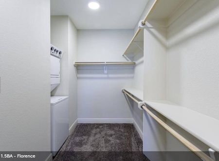 Carson Street Towers - Closet with Plush Carpeting, Built-in Shelf Space, and a Washer and Dryer