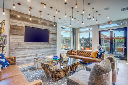 Resident entertainment lounge at the clubhouse at Midway Urban Village Luxury Townhomes and loft apartments in Farmers Branch, Texas near North Dallas. Luxury North Dallas Townhomes for rent