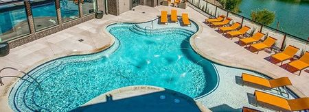 Resort style pool at Midway Urban Village Luxury Townhomes and loft apartments in Farmers Branch, Texas near North Dallas. Luxury North Dallas Townhomes for rent