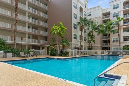 Outdoor pool surrounded by apartment building