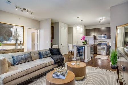 Open concept one-, two-, and three-bedroom apartment floorplans with wood style flooring