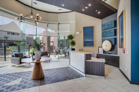 Leasing office with view of resort-style pool, grilling station, and fitness center