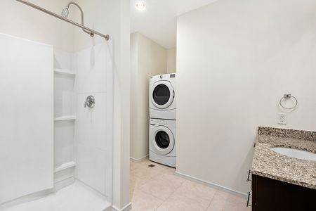 Full size stacked washer and dryer in the bathroom
