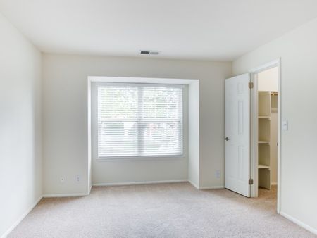 View of bedroom with walk-in closet.
