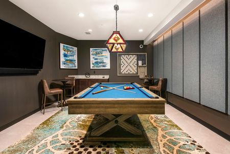 Emerald Row - Game Room Featuring a Pool Table and Large TV