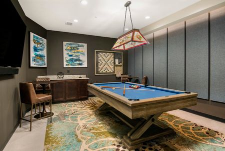 Game room with billiards table and TV