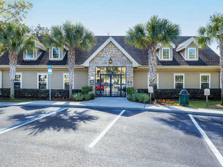 Big oaks apartments lakeland florida clubhouse exterior with parking