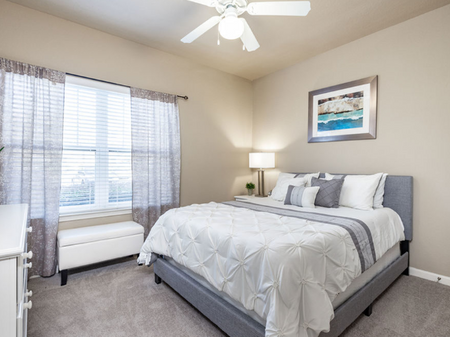 Big oaks apartments lakeland florida furnished bedroom with ceiling fan and carpet