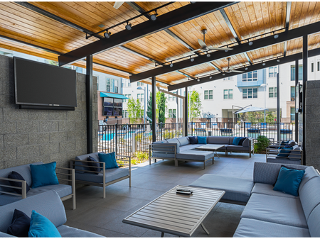 Outdoor Lounge Area with Two TVs!